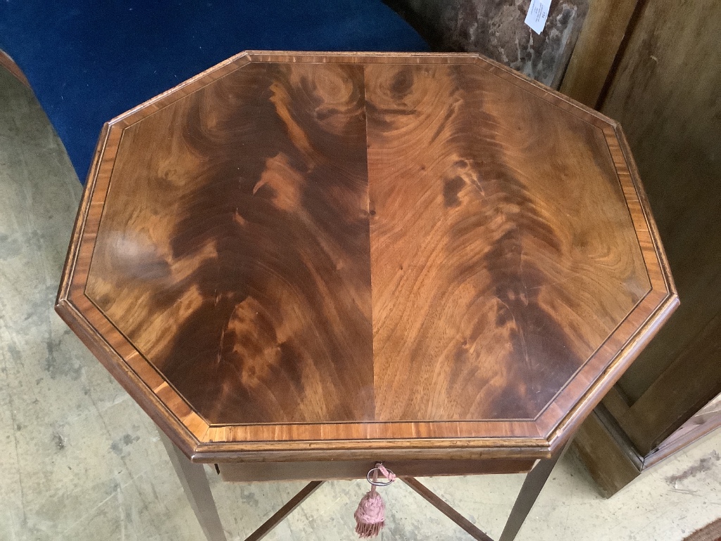 A George III banded mahogany octagonal topped work table